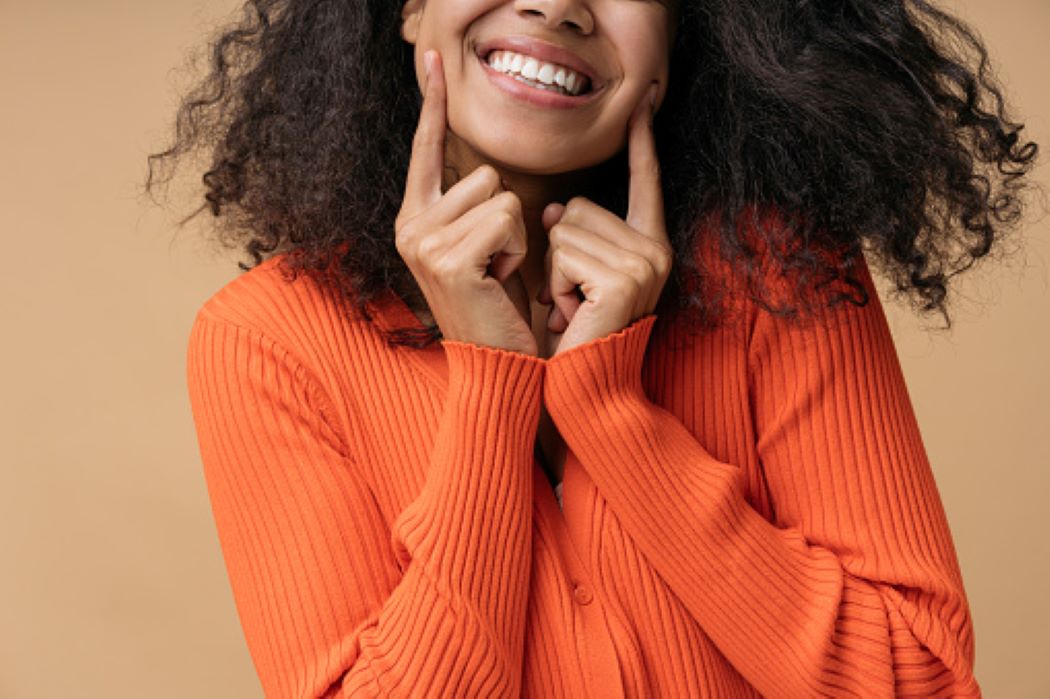A smiling patient feeling great after professional dental treatment in Moberly, MO.