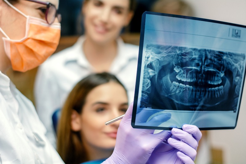 A dentist showing 3d digital imaging to a patient before undergoing a dental procedure in Moberly